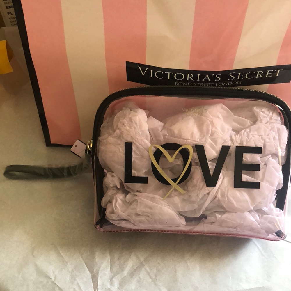 Victoria’s Secret Cosmetics or Perfume bag. LOVE Logo on front. Wristlet strap.